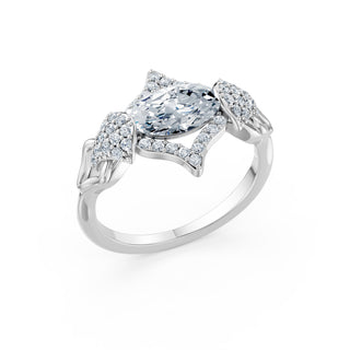 Colette ring in white gold, angled view showing the pavé wing shoulders