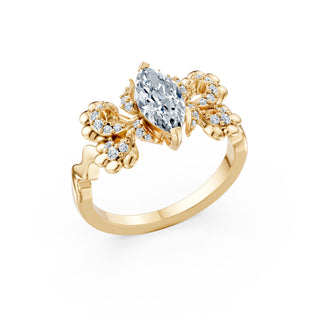 Primrose ring in yellow gold, angled view showing the floral clusters